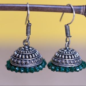 Classic silver jhumki with  green glass beads